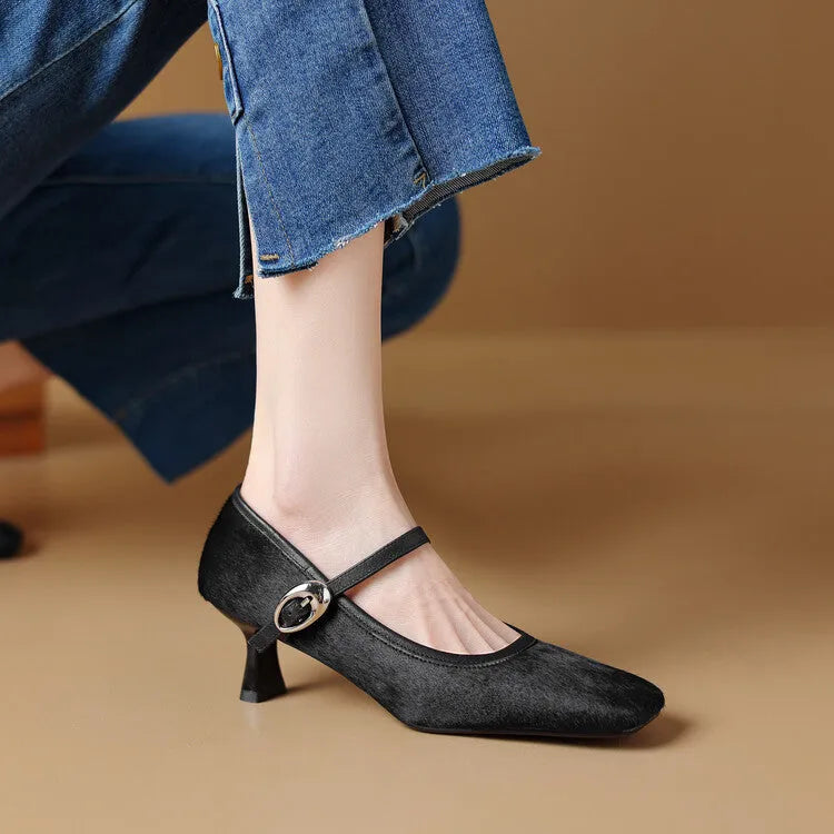Women's black square toe ankle-strap stiletto heels with horse hair upper on wooden surface