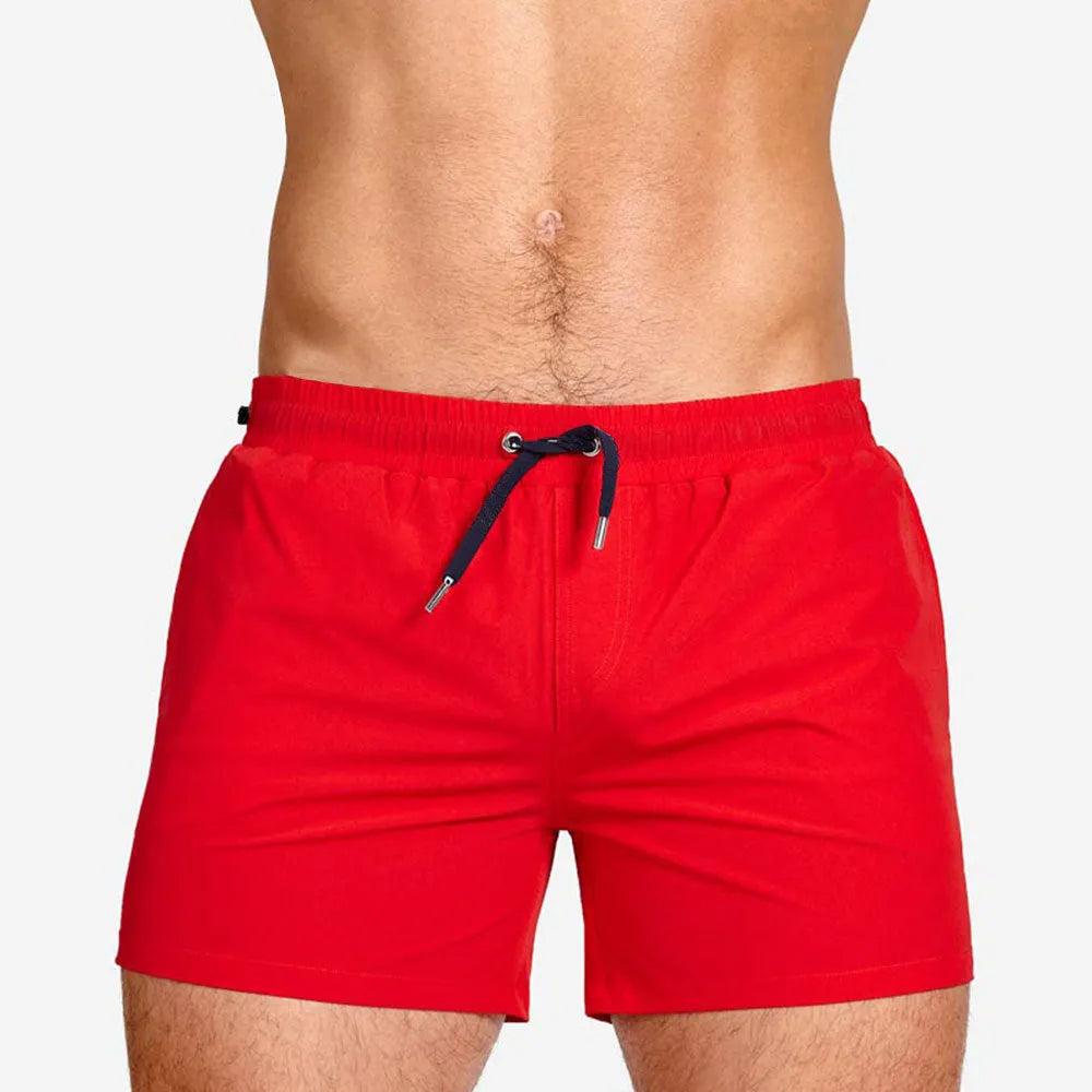 Men's solid colour swimming shorts with mesh lining for sports and fitness in Army Green.