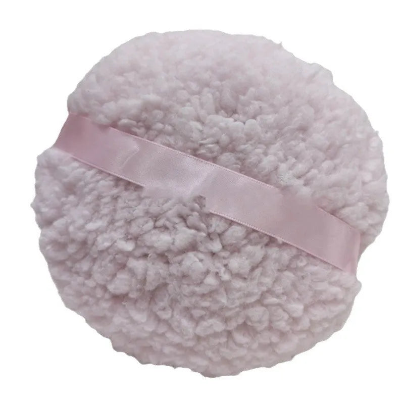 Oversized rectangular plush powder puff in pink, white, or skin colour on a plain background.