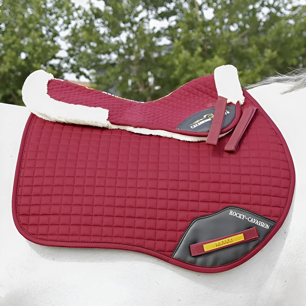 Riding saddle pad with wool construction for shock absorption during equestrian and cycling activities