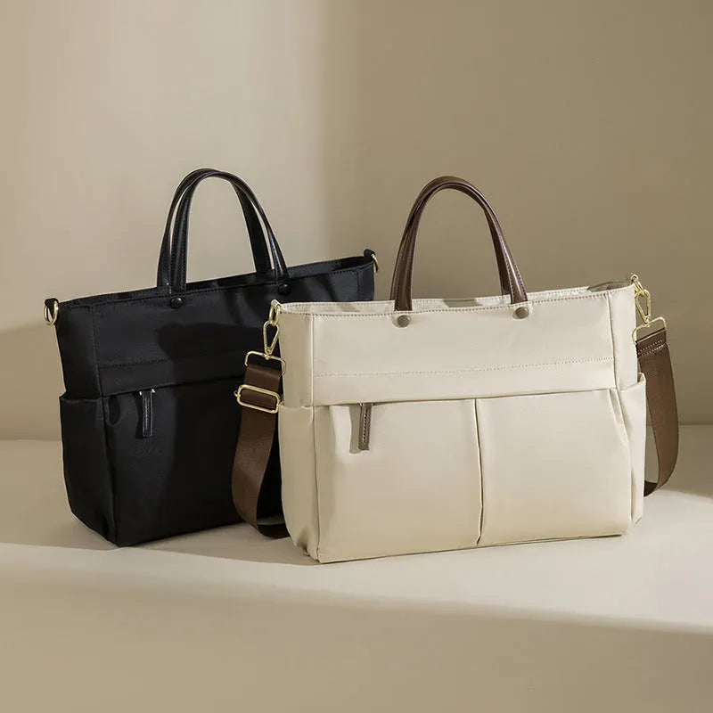 Women's oxford cloth laptop briefcase in elegant black showing open pocket and stitching detail