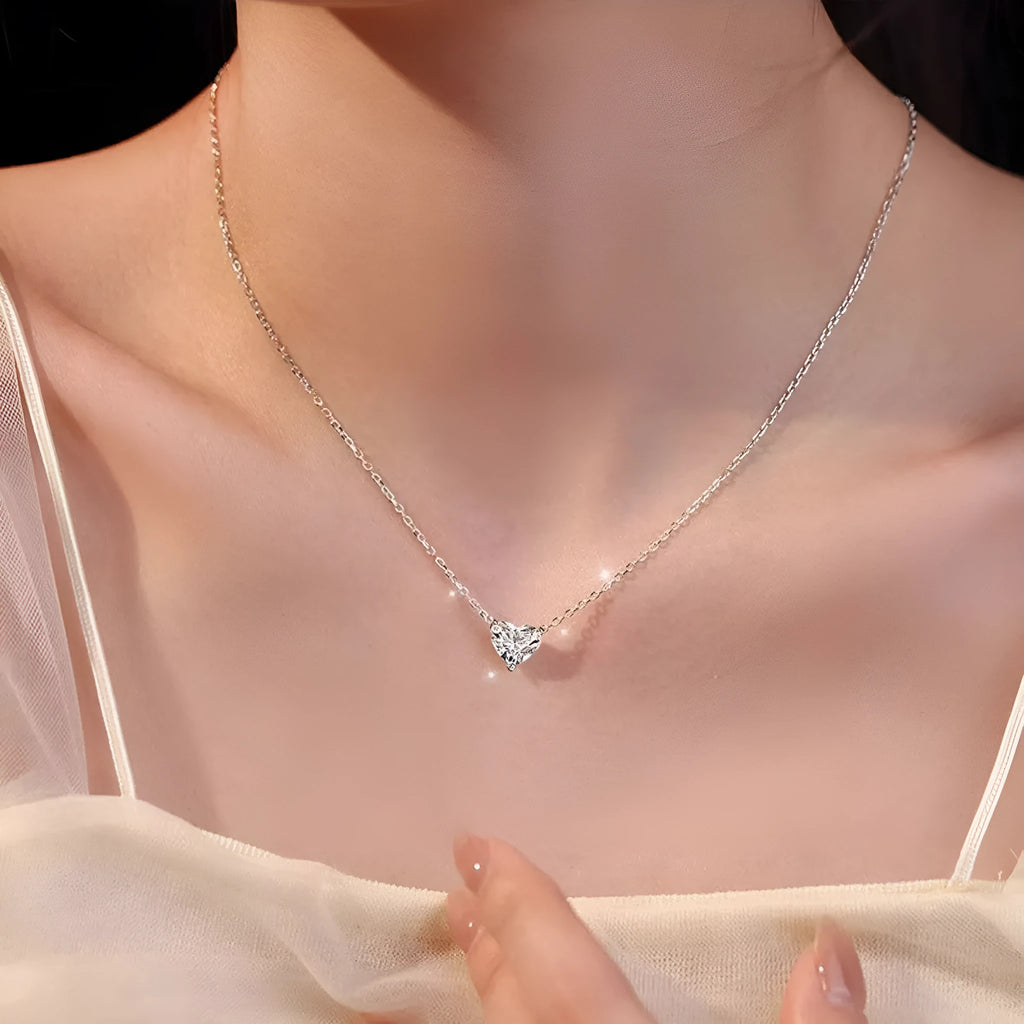 Women's simple copper necklace with silver heart-shaped pendant on display