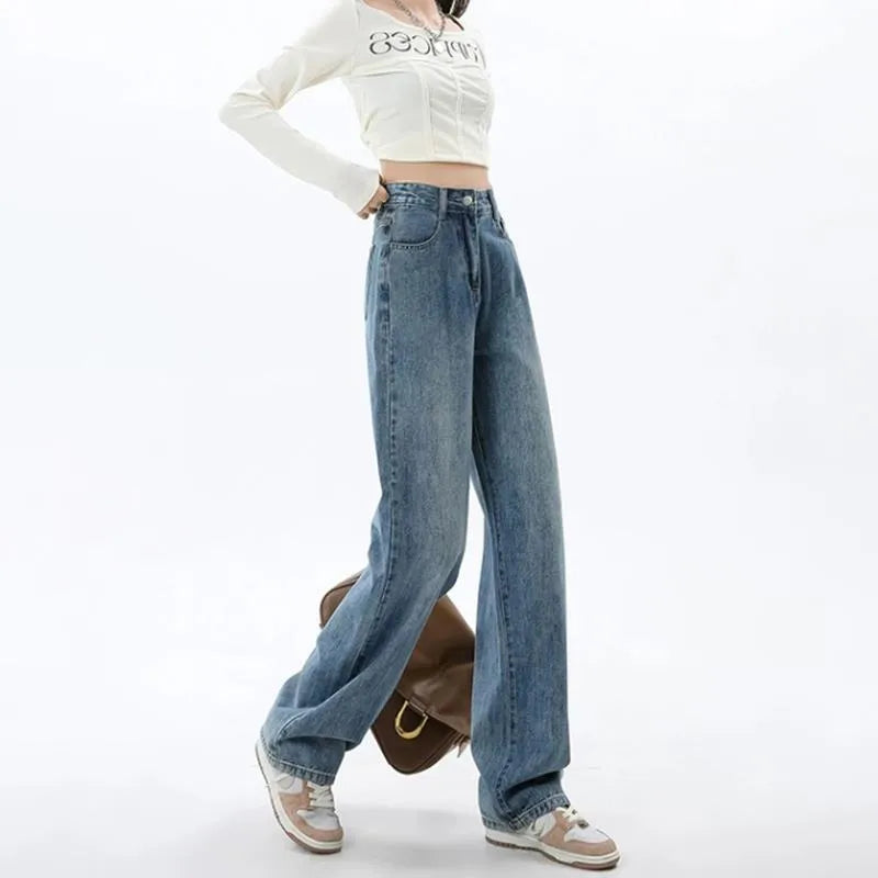A woman wearing high-waisted retro blue wide-leg jeans made from stretch denim.