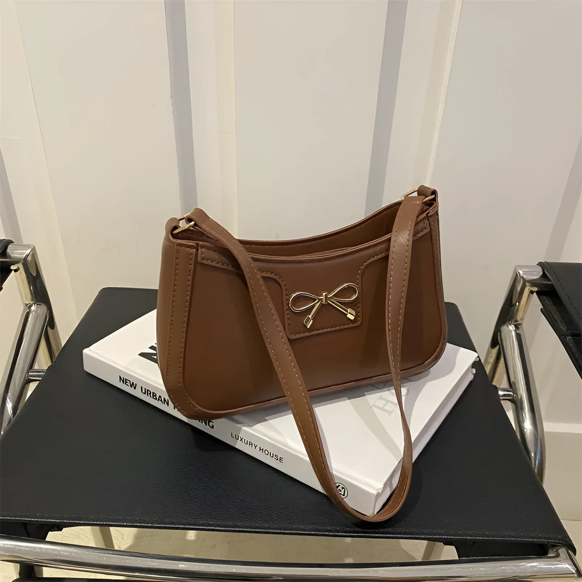 Western-style baguette shoulder bag in PU leather with bow detail, 24cm wide