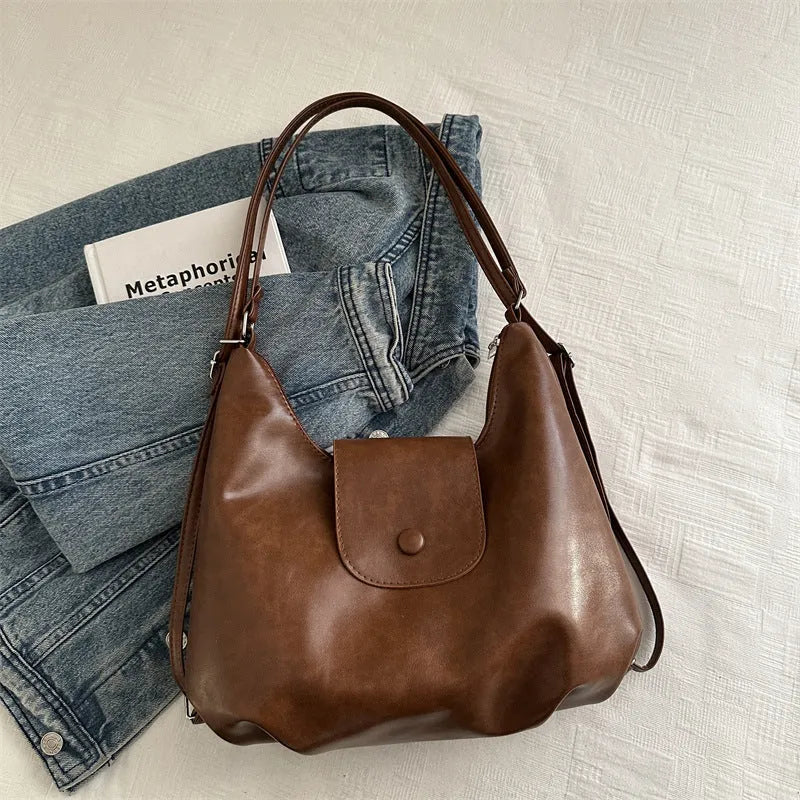 Textured PU leather commuter backpack with horizontal square design and single shoulder strap