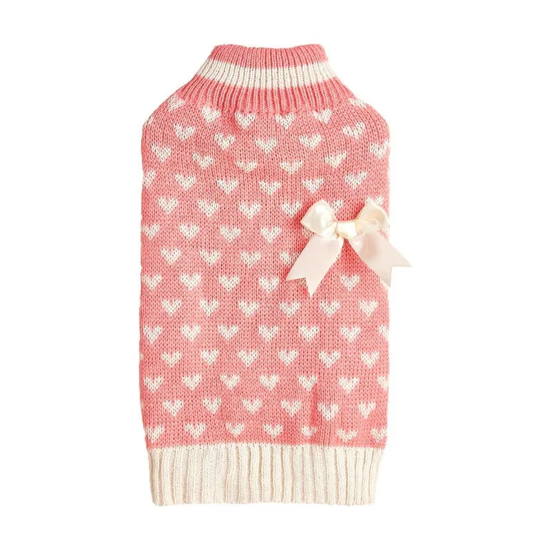 Red dog sweater with a white love heart pattern on the back, sized for a small dog.