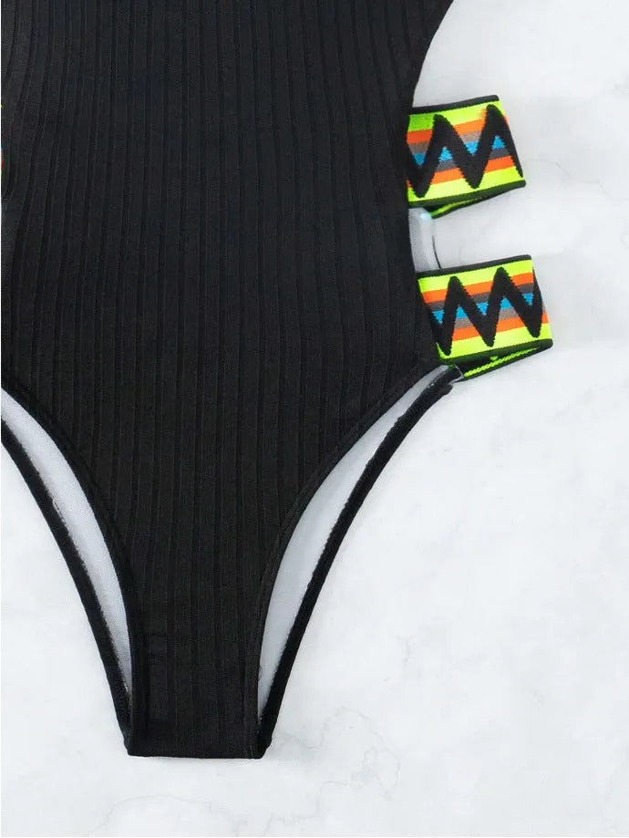Women's solid colour one-piece swimsuit bikini in black or orange, made from polyester fabric.