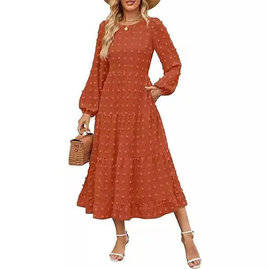 Women's long sleeve dress with ruffled sleeves and high waist in a solid colour.