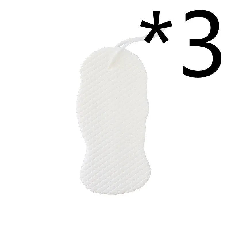 White 3D fish scale pattern bath sponge ball with hanging loop on a grey background.
