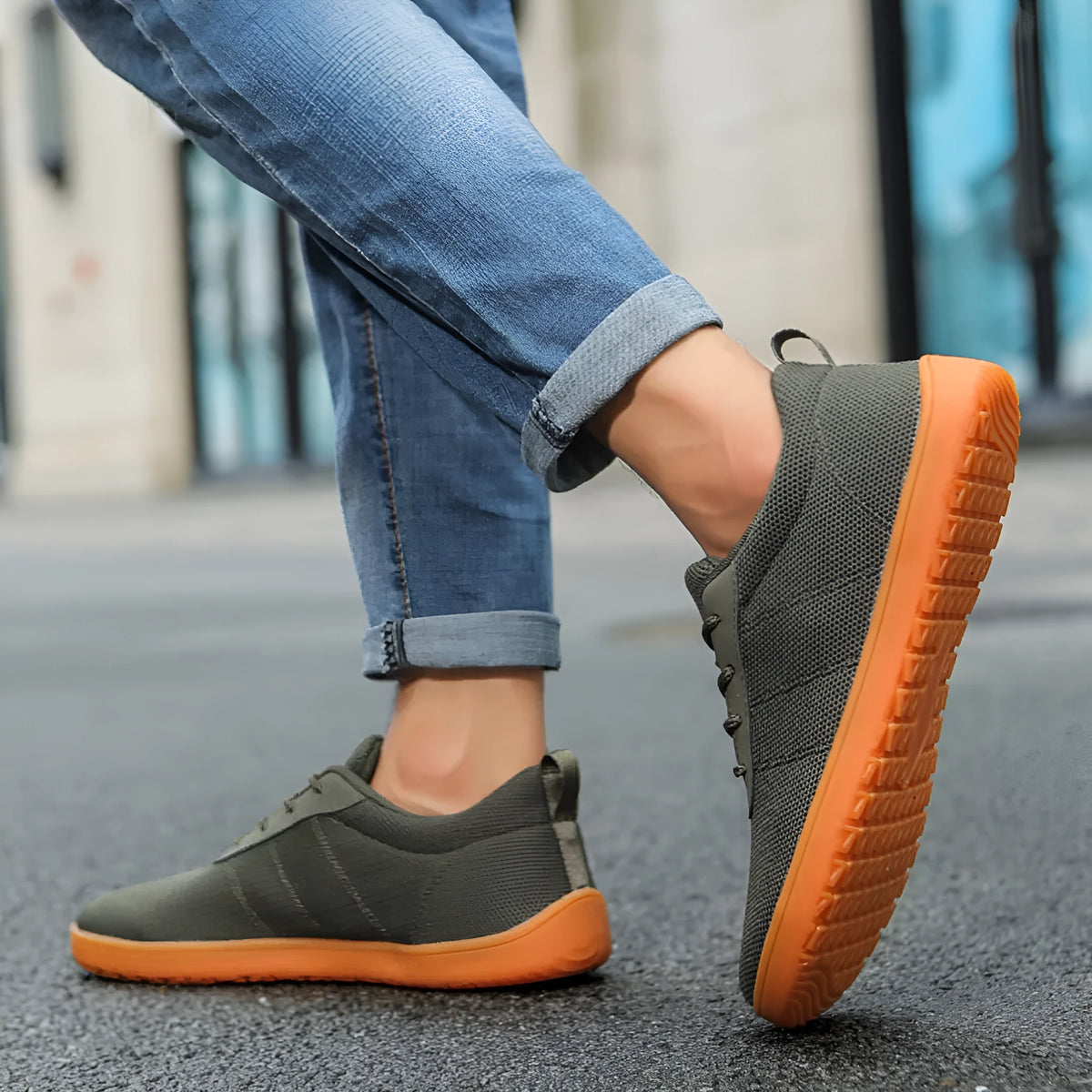 Men's low-top casual walking shoes in black with Flyknit upper, round wide toe, and rubber sole.