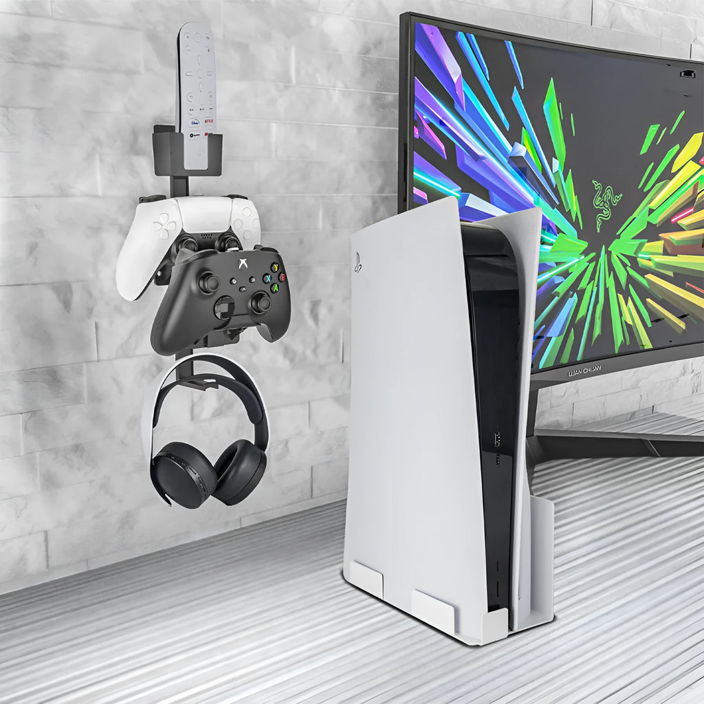 White ABS plastic wall hook holding a black game controller.