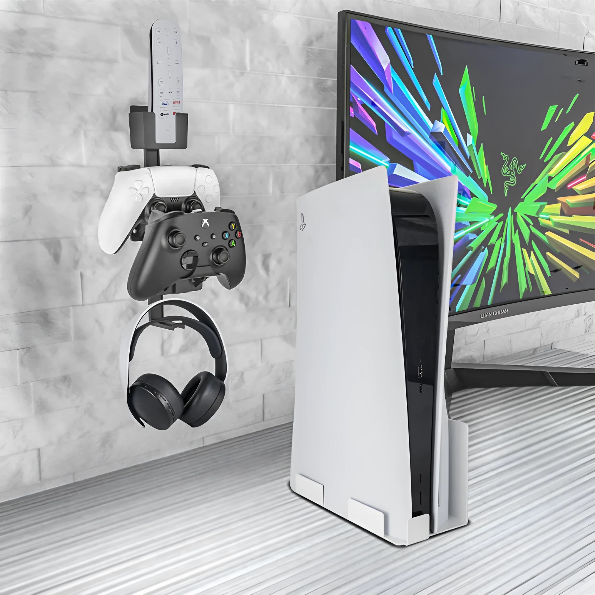 White ABS plastic wall hook holding a black game controller.