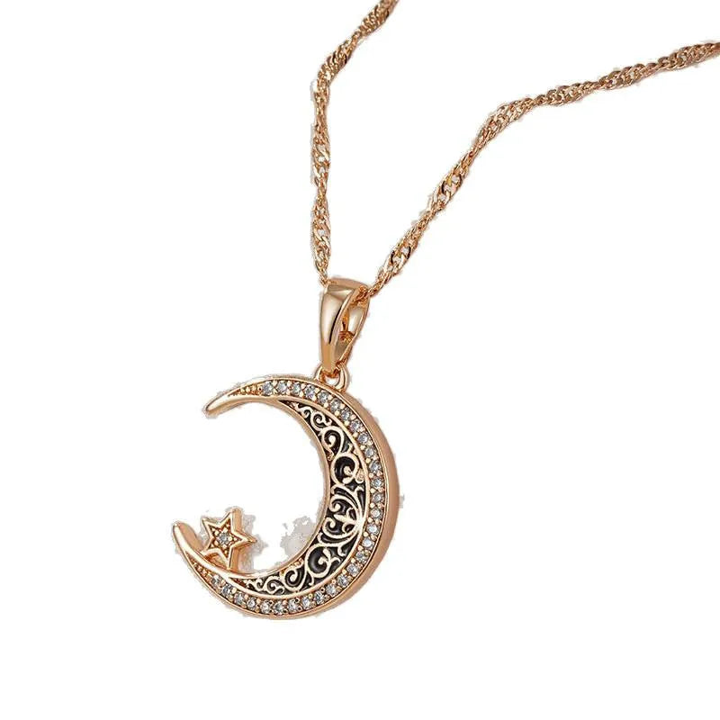 Rose gold star moon pendant necklace with zircon and enamel details on adjustable water wave chain