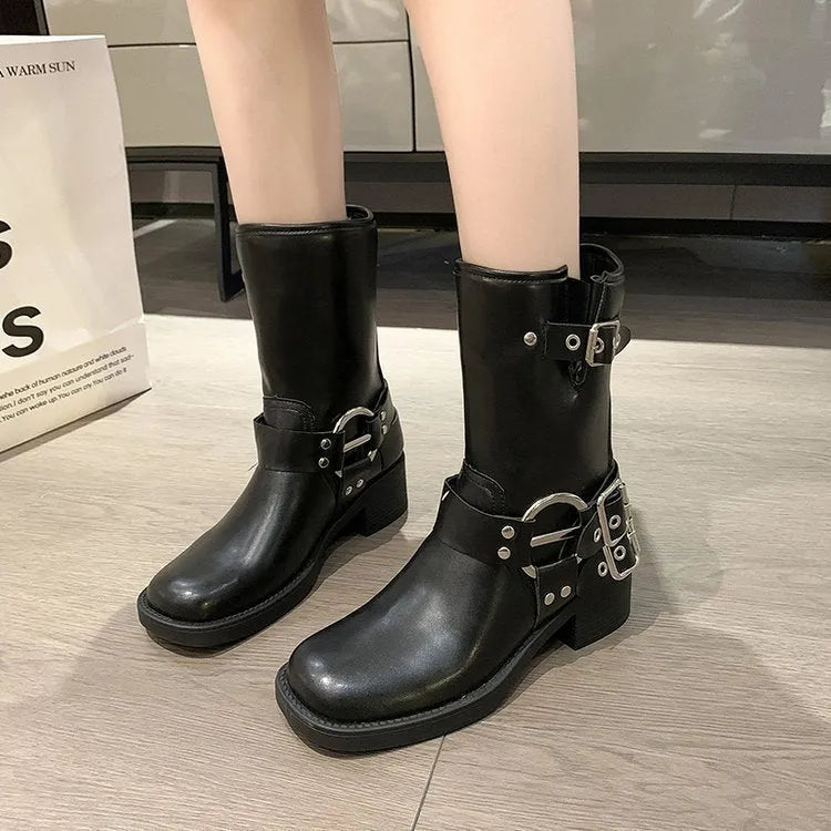 Women's black platform boots with buckle detail and mid-calf length