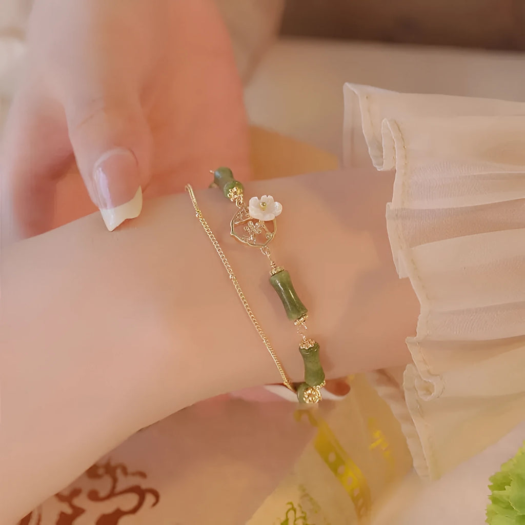 Handmade natural olivine stone bracelet with double layer twin bells of Ireland design.