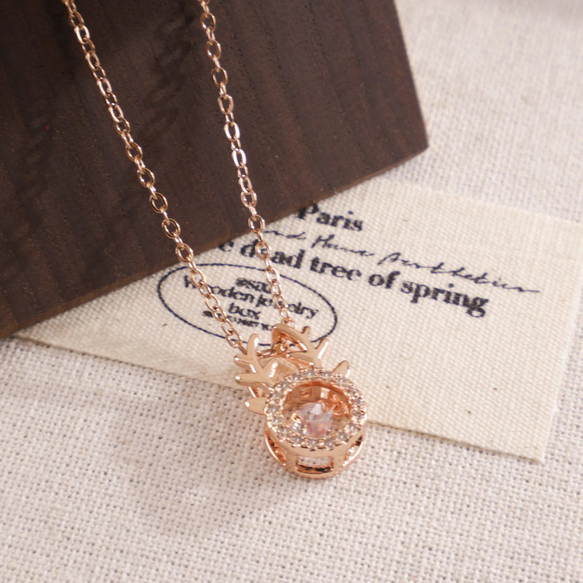 Antlers necklace with titanium steel cross chain and copper pendant, shown in one of sixteen colour options