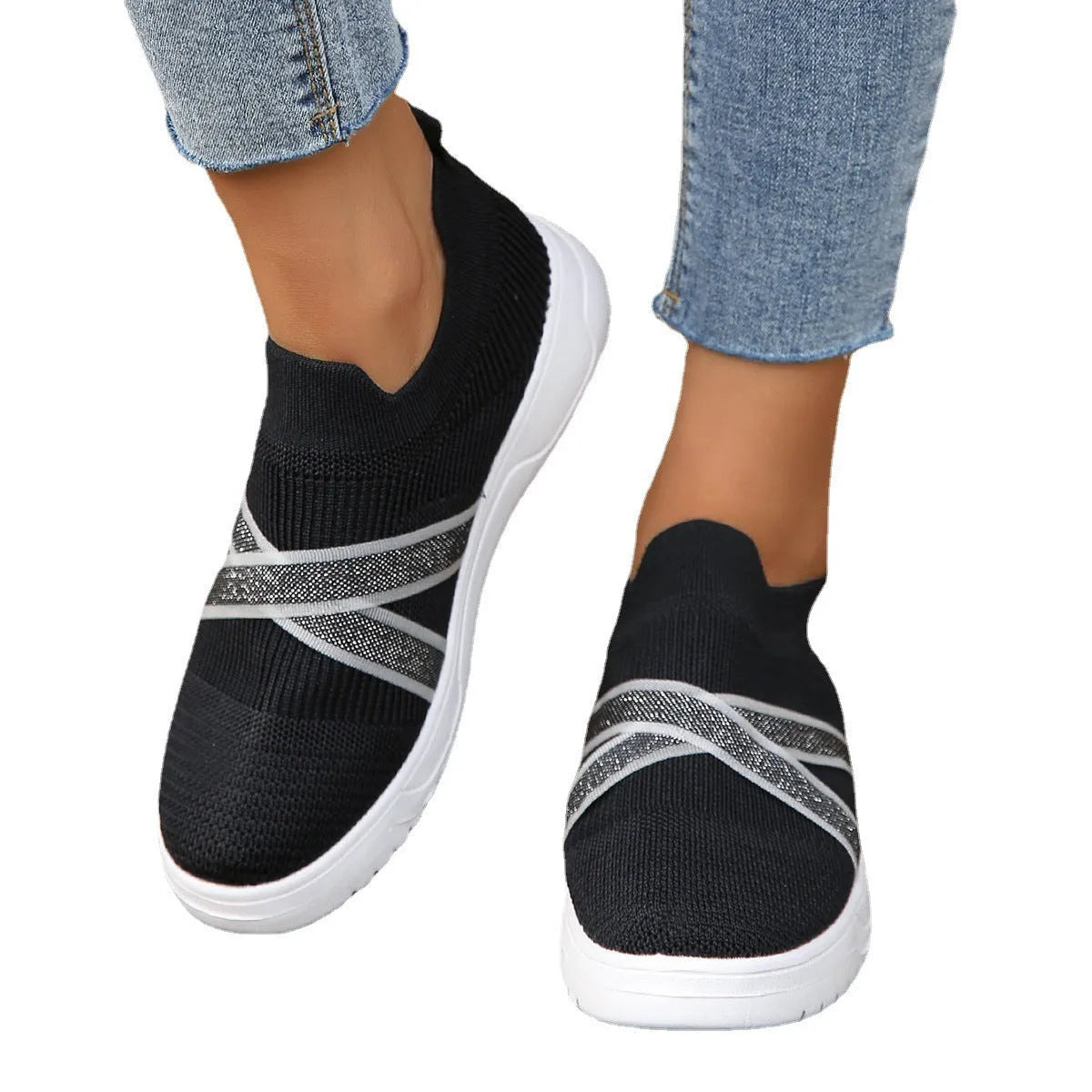 Black women's flyknit mesh casual shoes with flat rubber sole and tassel detail
