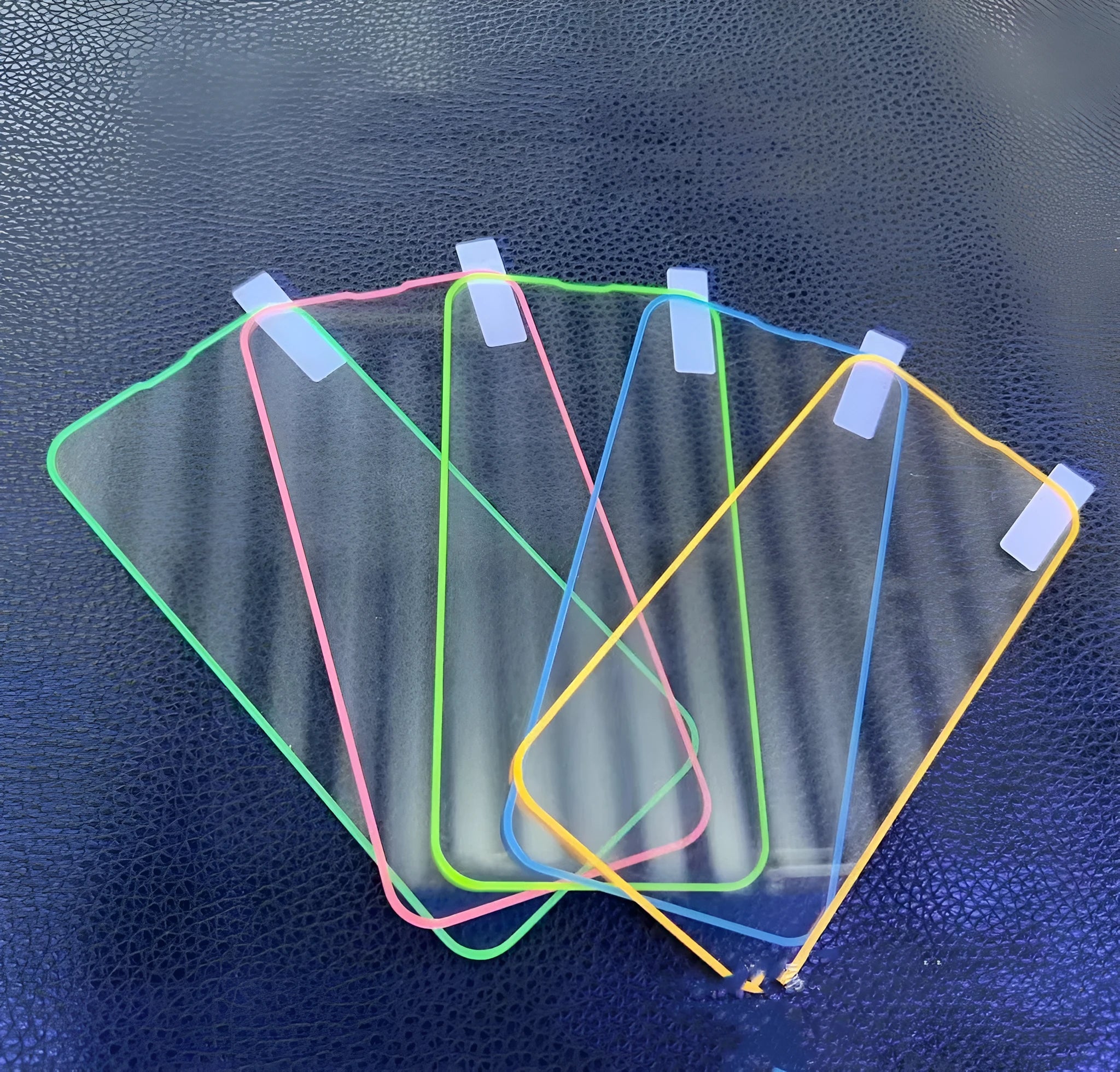 Fluorescent tempered glass screen protector for iPhone showing luminous glow in blue colour