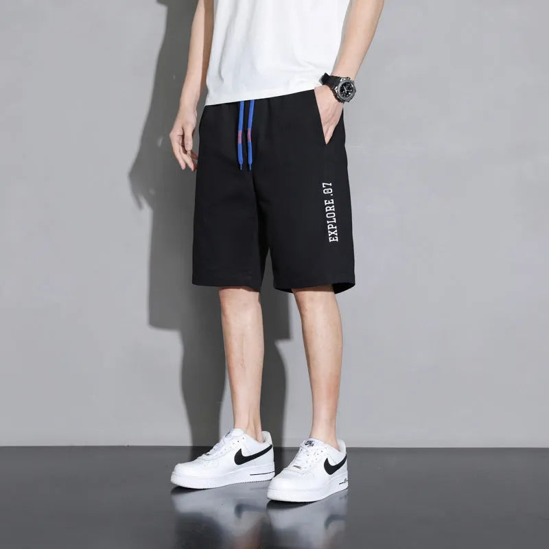Cotton shorts for teenage boys in black, khaki, and white, showing mid-waist fit and shorts length.