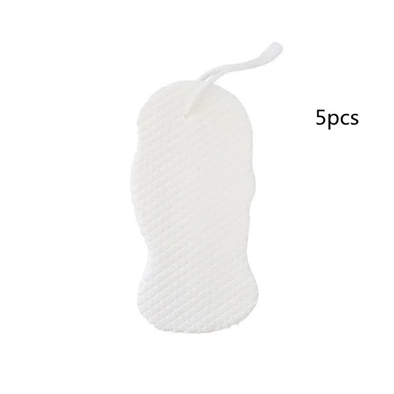 White 3D fish scale pattern bath sponge ball with hanging loop on a grey background.
