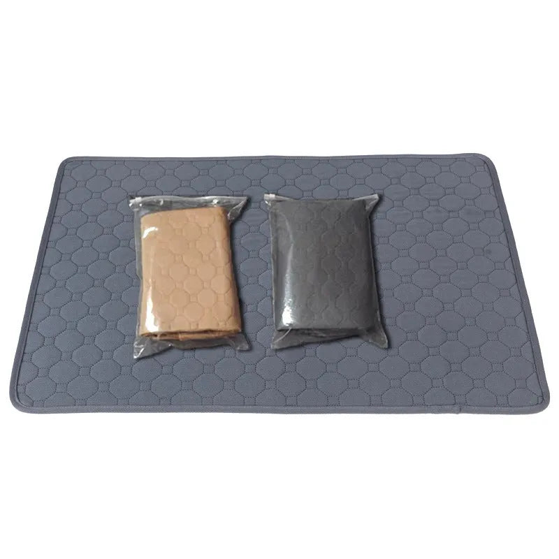 Two neutral-coloured washable dog pee pads, one tan and one grey, showing textured fabric surface.