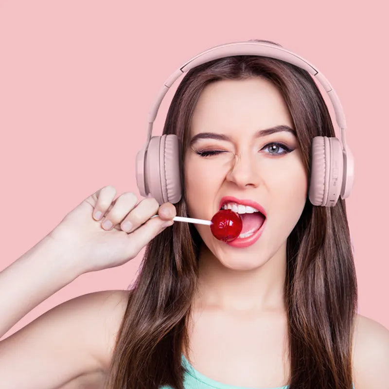 Children's wireless headphones with RGB lights in bunny pink colour showing power display and microphone