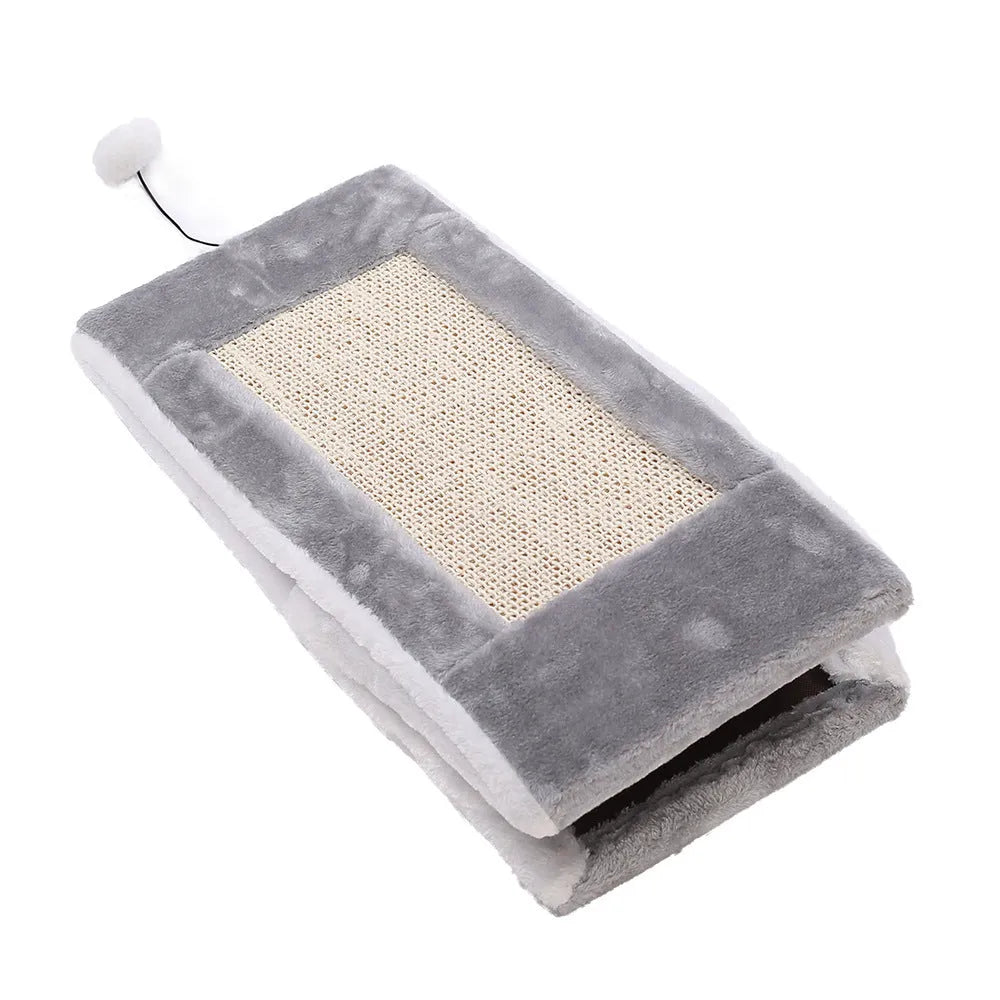 Grey and white triangular cat bed with sisal scratching side and soft fur sleeping mat.
