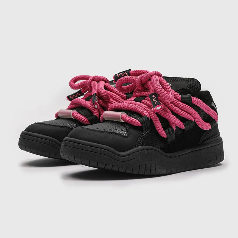 Low-top lace-up casual sneakers in denim blue with a round toe and thick rubber sole.