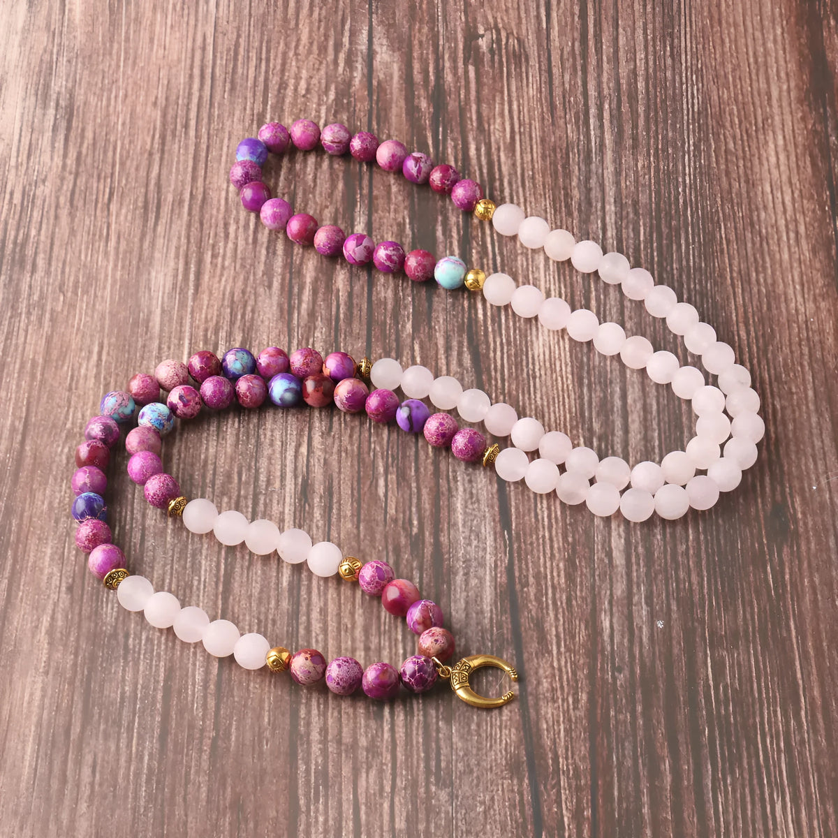 Pink crystal Emperor Stone beads pendant necklace on model, showing round beads and adjustable chain