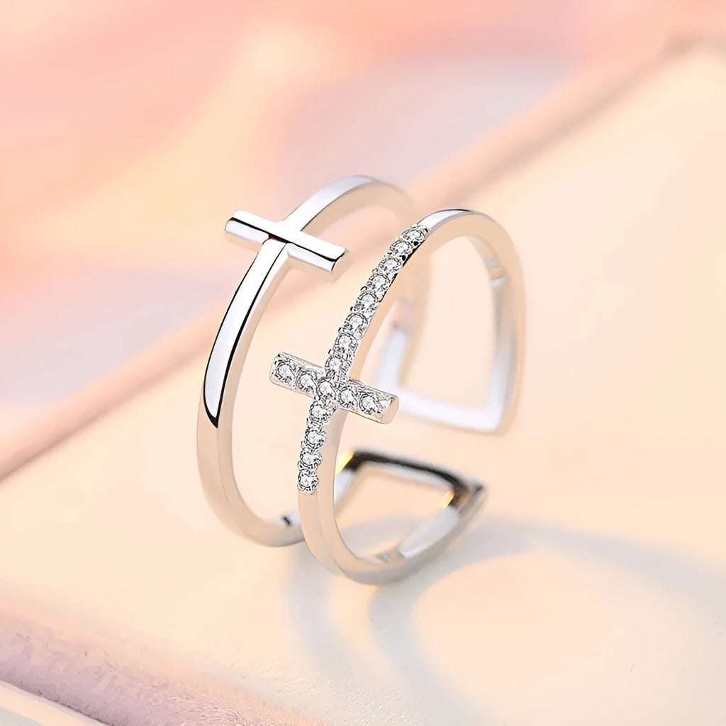 Women's double cross geometric open ring with zircon inlay on copper, showing adjustable opening.
