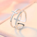Women's double cross geometric open ring with zircon inlay on copper, showing adjustable opening.