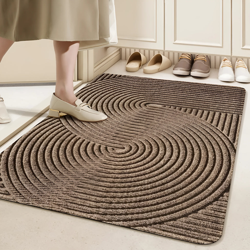 Green alien-shaped floor mat with cartoon pattern, measuring 60 by 90 cm with a wire ring border.