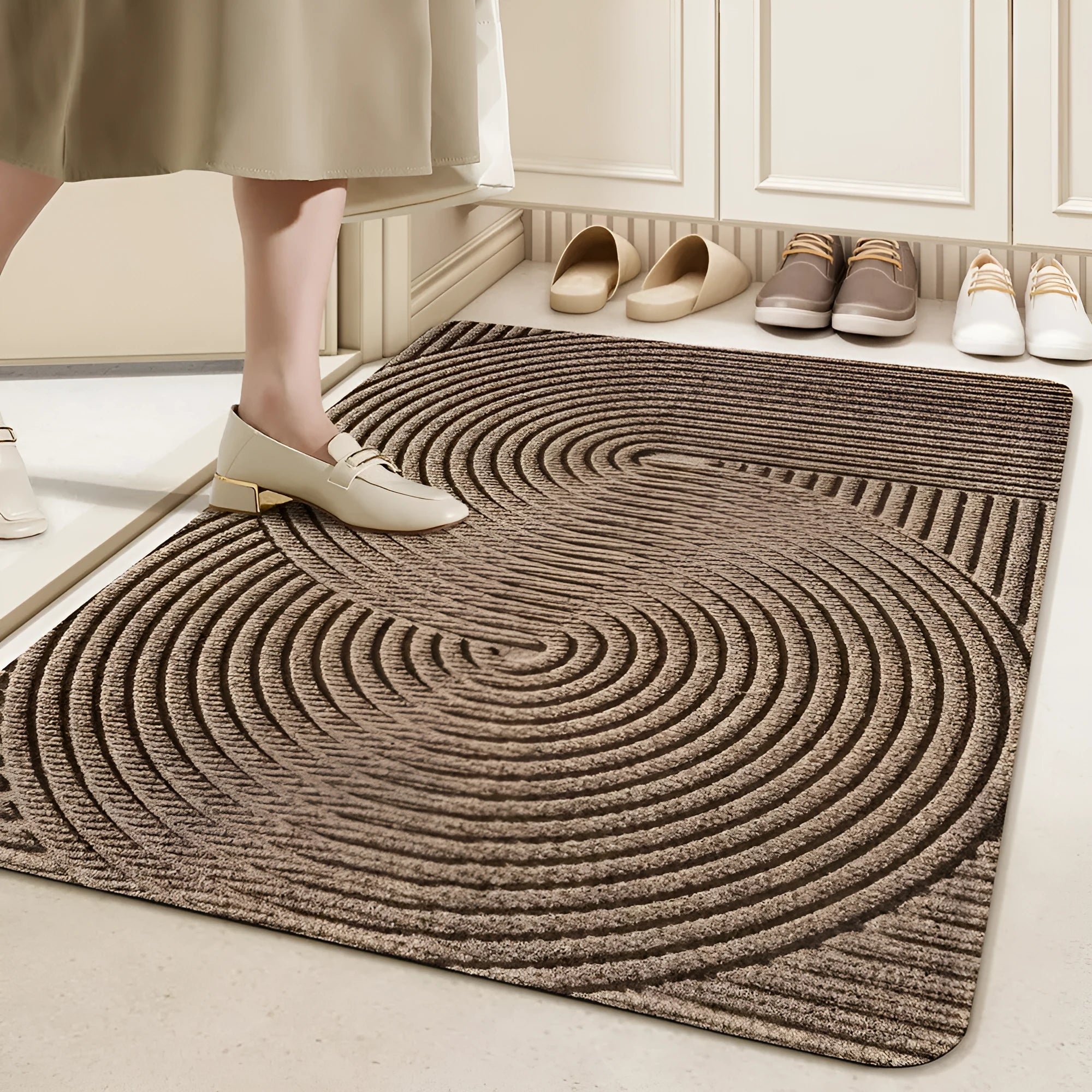 Green alien-shaped floor mat with cartoon pattern, measuring 60 by 90 cm with a wire ring border.