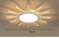 Modern circular aluminium LED ceiling lamp with remote control shown in room setting