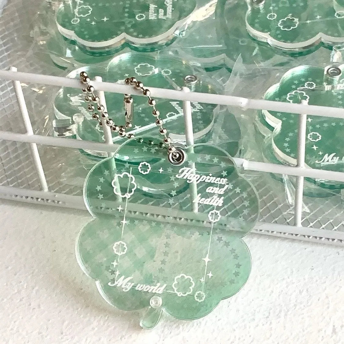 Acrylic four-leaf clover phone pendant in three colour variations