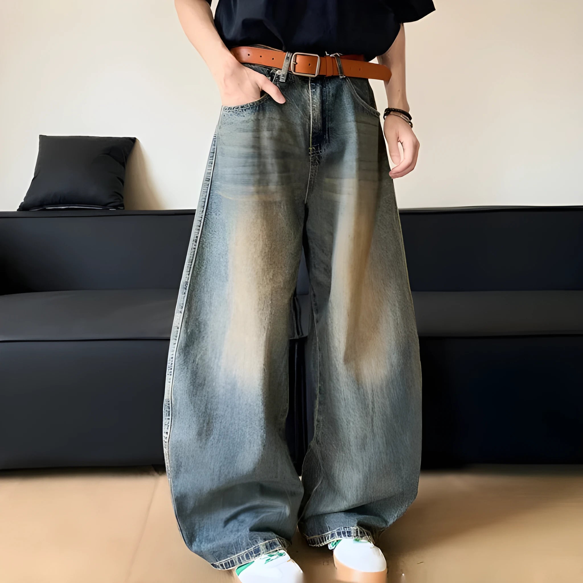 Men's retro blue distressed denim wide-leg trousers showing distressed detailing and wide-leg silhouette