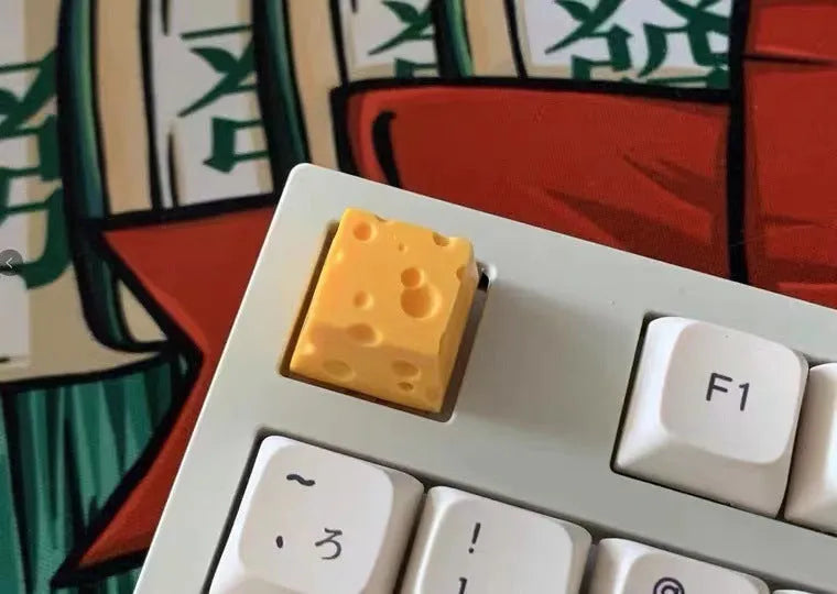 Resin cheese key cap for mechanical keyboards with yellow decorative cheese wedge design