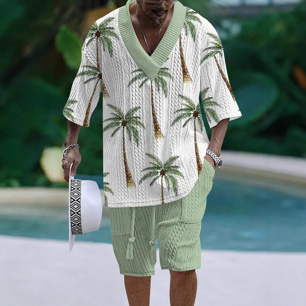 Man wearing a loose-fitting short-sleeve top and matching casual shorts in a solid colour.
