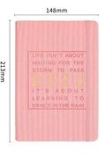 Student almanac calendar notebook with imitation leather cover showing wire-O binding and monthly design pages