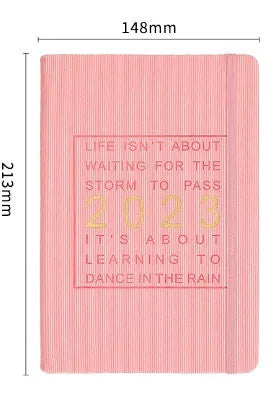 Student almanac calendar notebook with imitation leather cover showing wire-O binding and monthly design pages