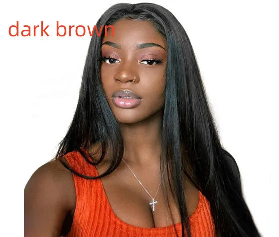 A woman wearing a long straight black wig with centre-parted bangs.