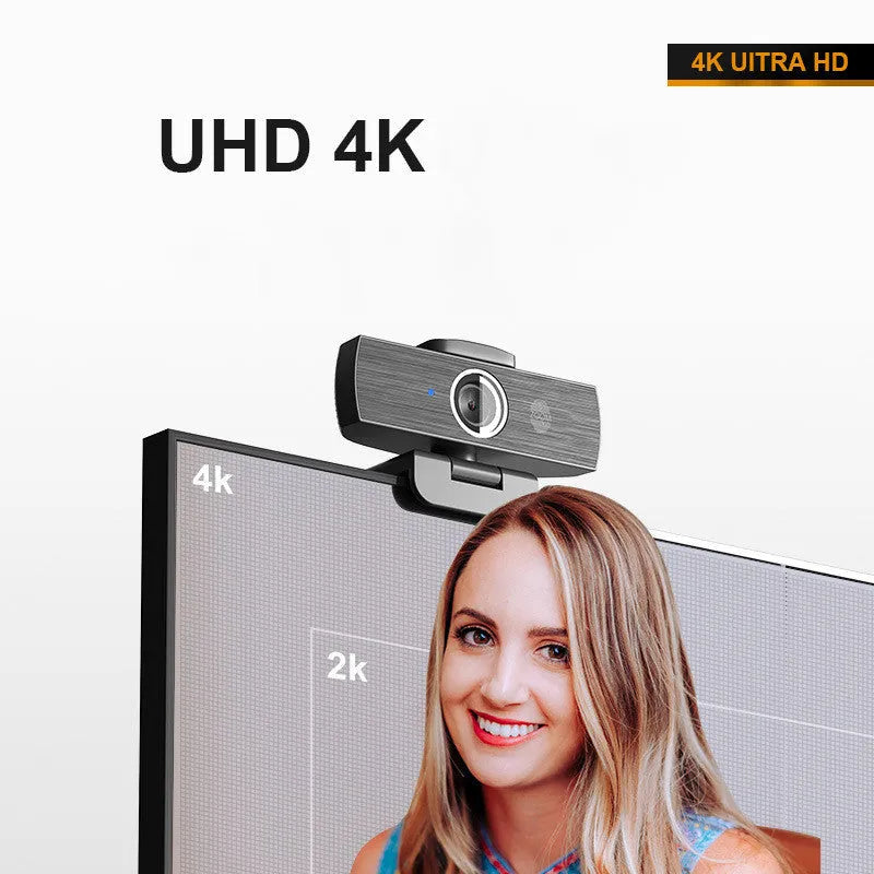 Black USB webcam with magnetic privacy cover on a laptop, showing 4K resolution and 60FPS specifications.