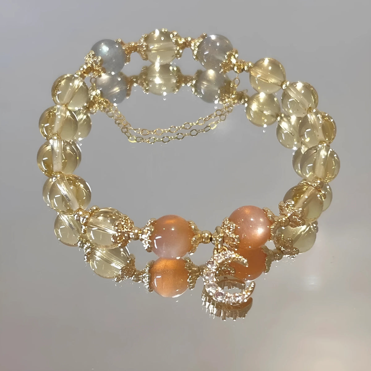 Chinese style women's crystal bracelet with moonstone golden sun stone design and gold electroplating