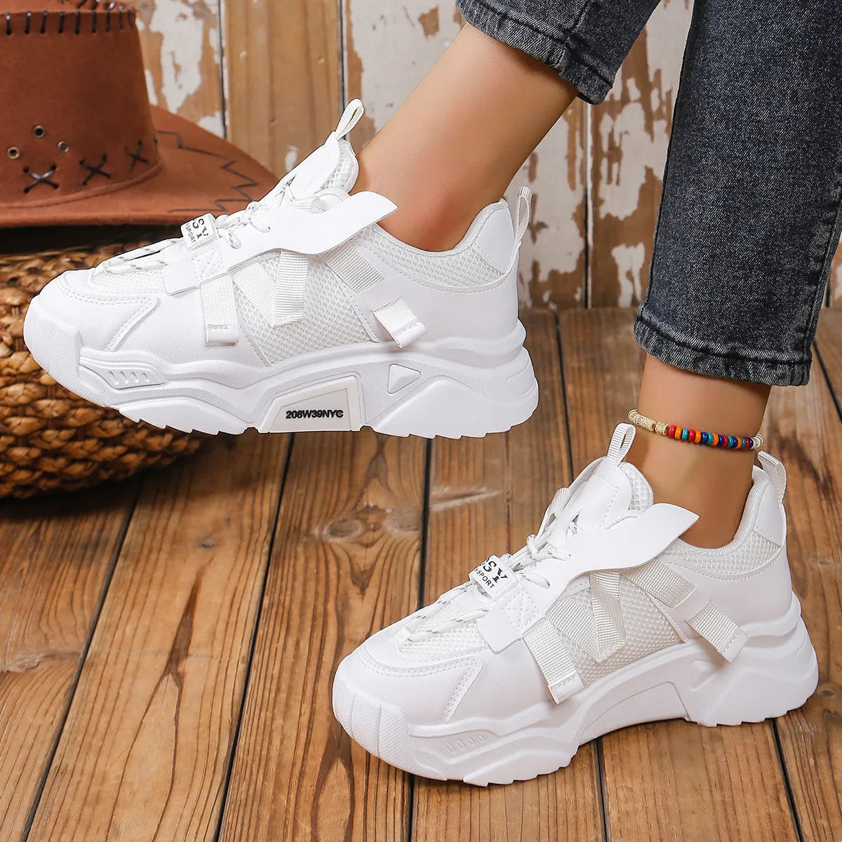 Women's purple platform mesh sports trainers with animal pattern and lace-up front on a white background.