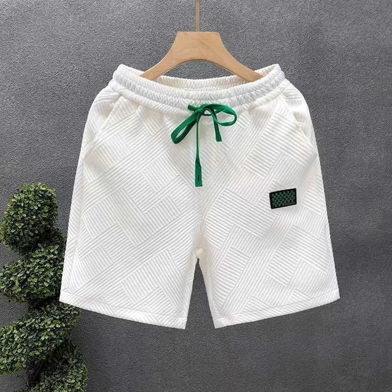 A pair of solid-colour casual sports shorts made from polyester, shown in white, suitable for beach and outdoor activities.