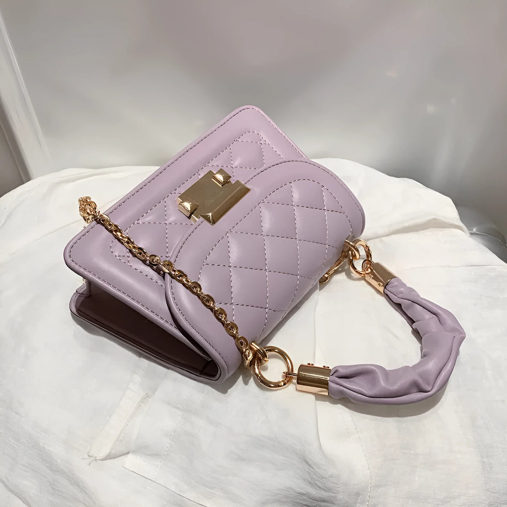 Small purple rhombus-shaped square shoulder bag with a long crossbody strap