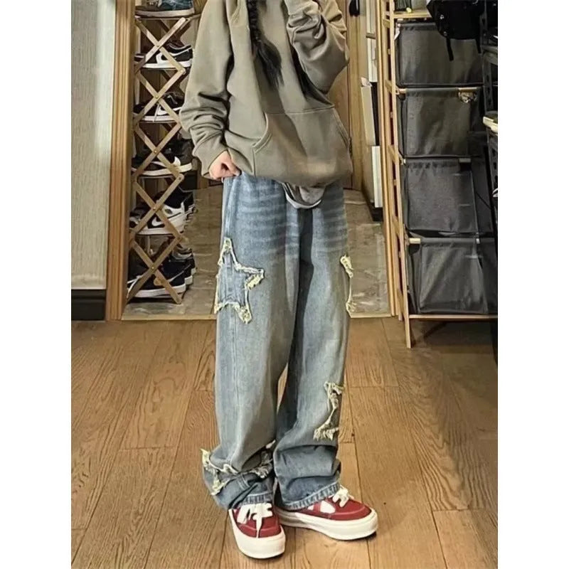 Blue women's high waist wide-leg denim jeans on a hanger, showing straight leg cut.