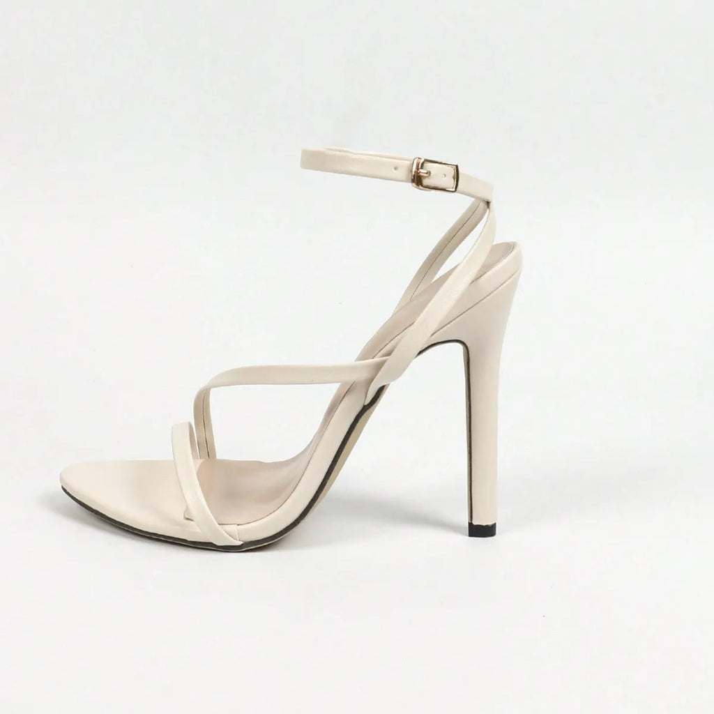 Women's gold open toe high heels with a cross ankle strap and round toe on a rubber sole.