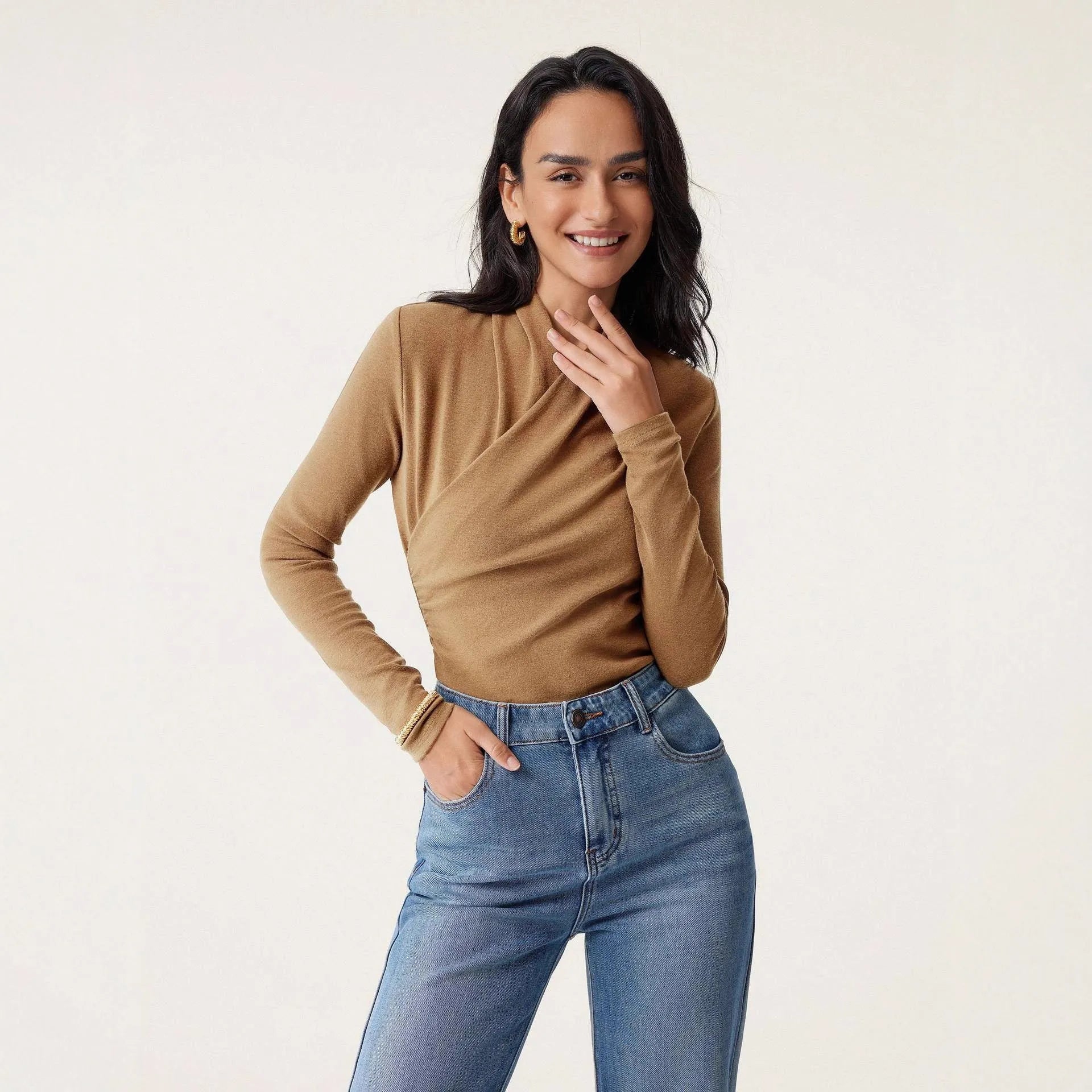 Camel-coloured women's slim-fit polyester pullover sweater on a hanger.