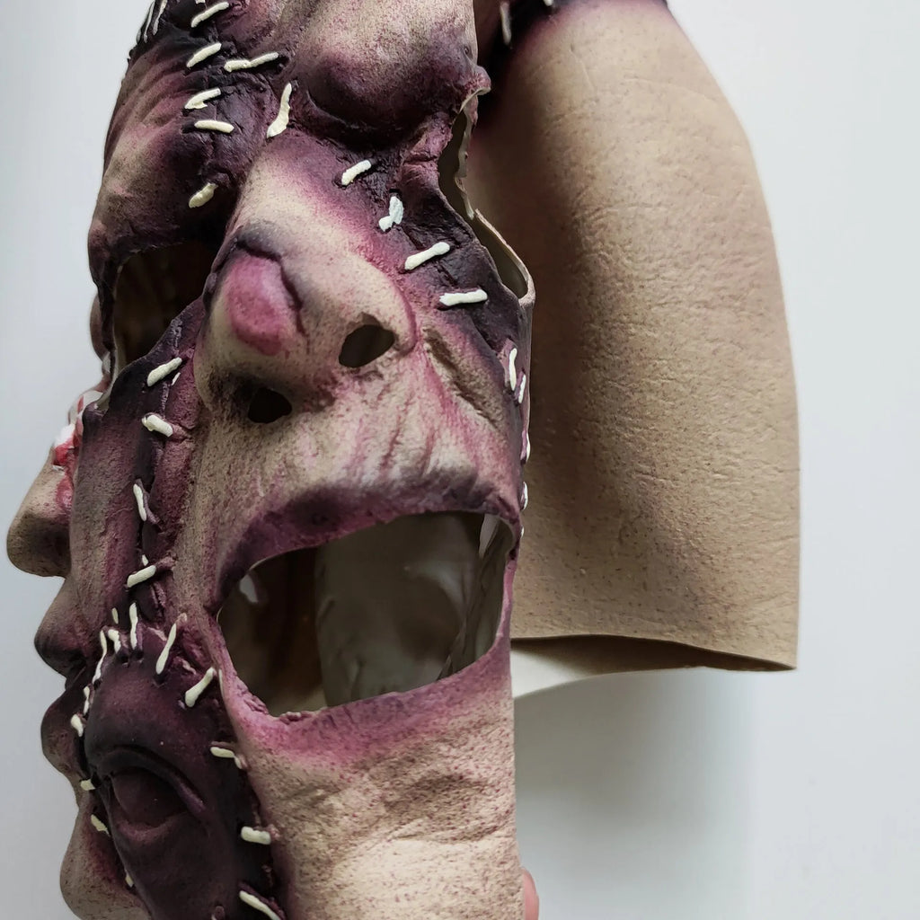 Three-sided grimace horror mask showing latex texture and comprehensive facial coverage for Halloween costumes